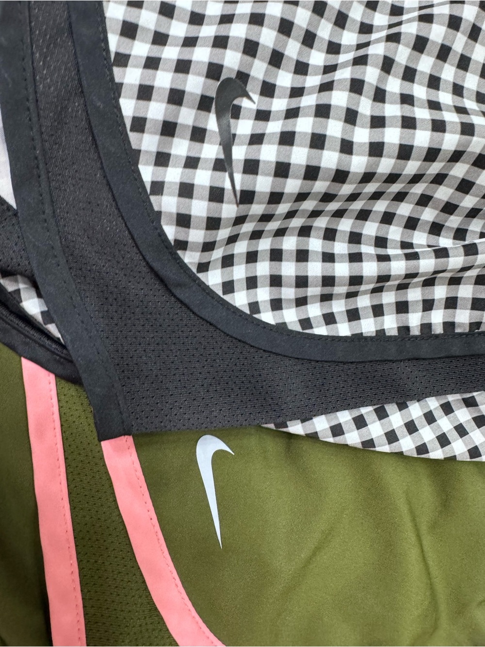 2 Nike Women’s athletic shorts in Olive Green w/pink trim, & Black Gingham
